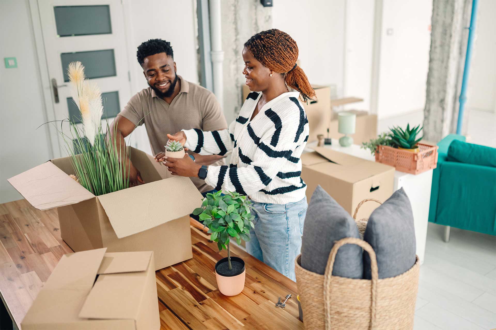 Happy couple moving into new home